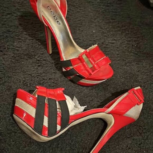 This is a pair of red women's high-heel sandals from the bebe brand. - Picture 4 of 4